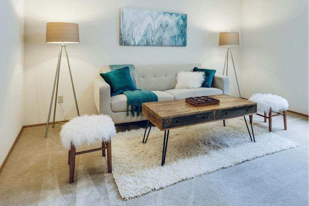 L-shaped adjustable desk in corner office